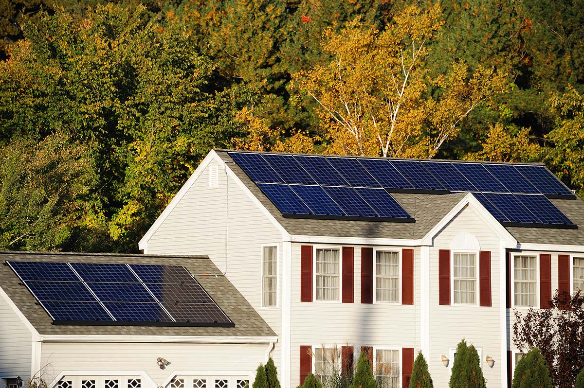 Home in Massachusetts with rooftop solar panels showing how solar panel installation works for homeowners.