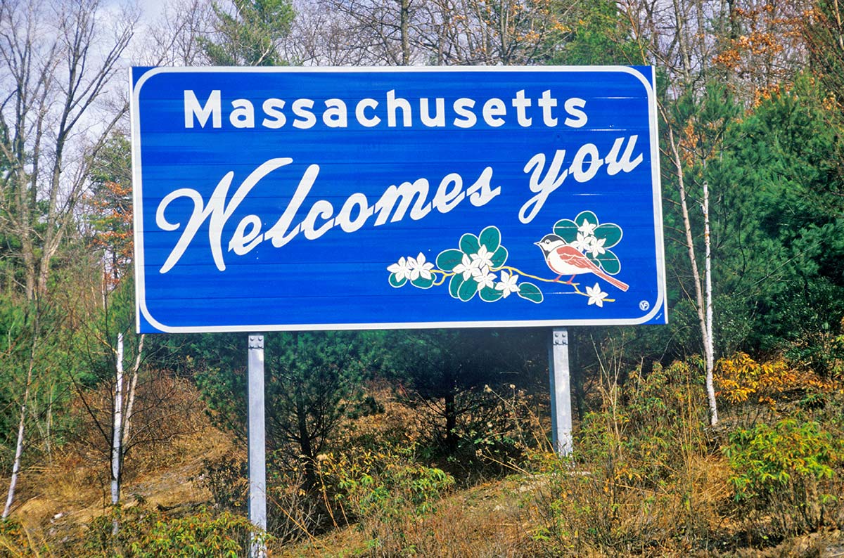 Massachusetts welcome sign, introducing state net metering policies and solar energy programs