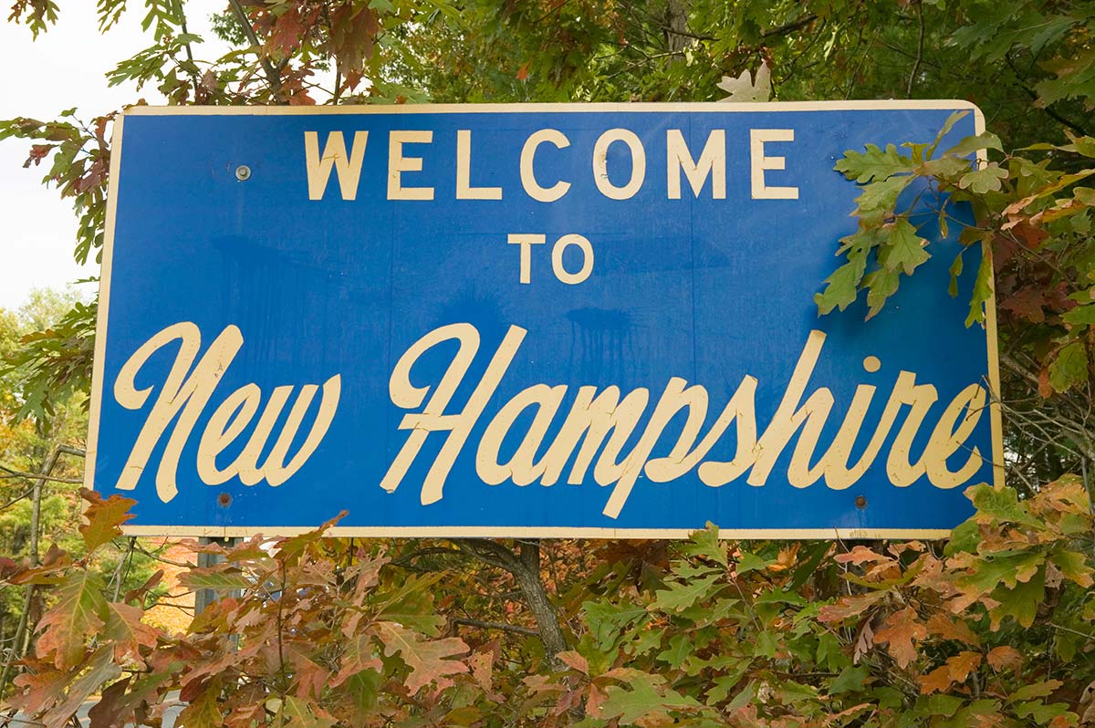 Welcome to New Hampshire sign, where net metering rules support solar customers