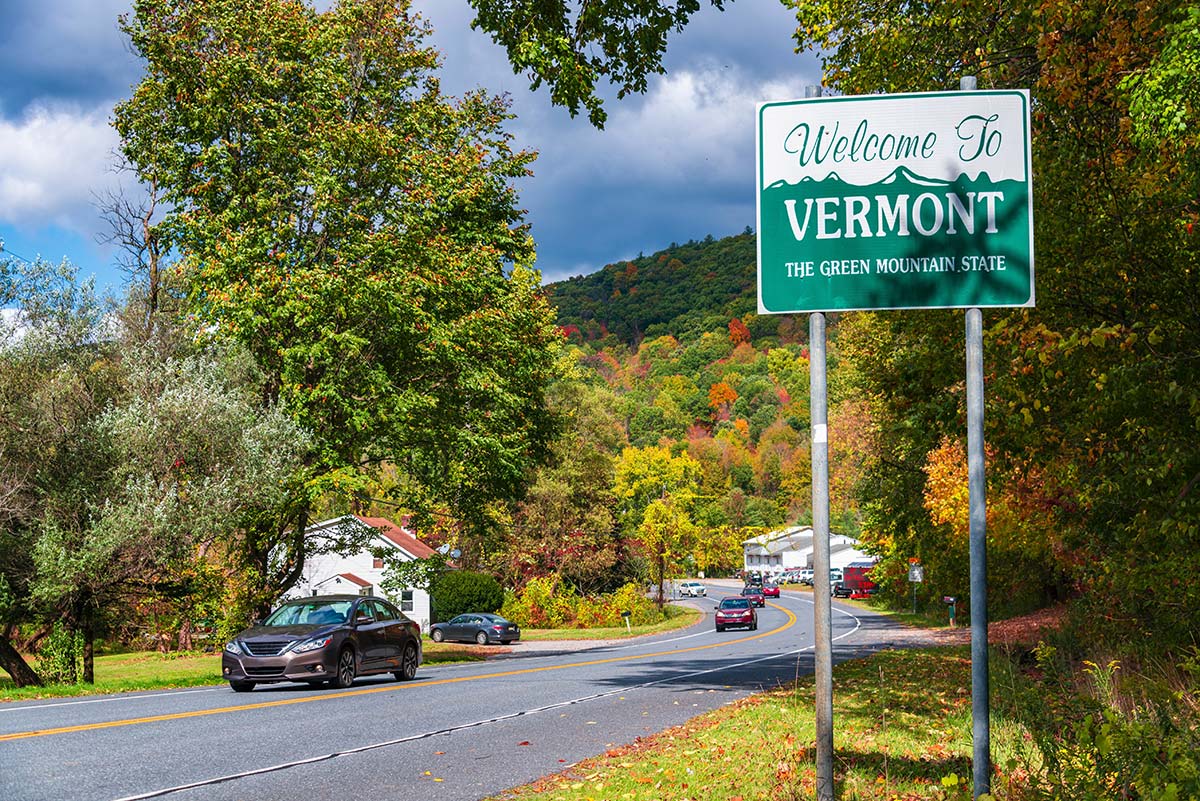 Welcome to Vermont sign, highlighting net metering credits and renewable energy adoption