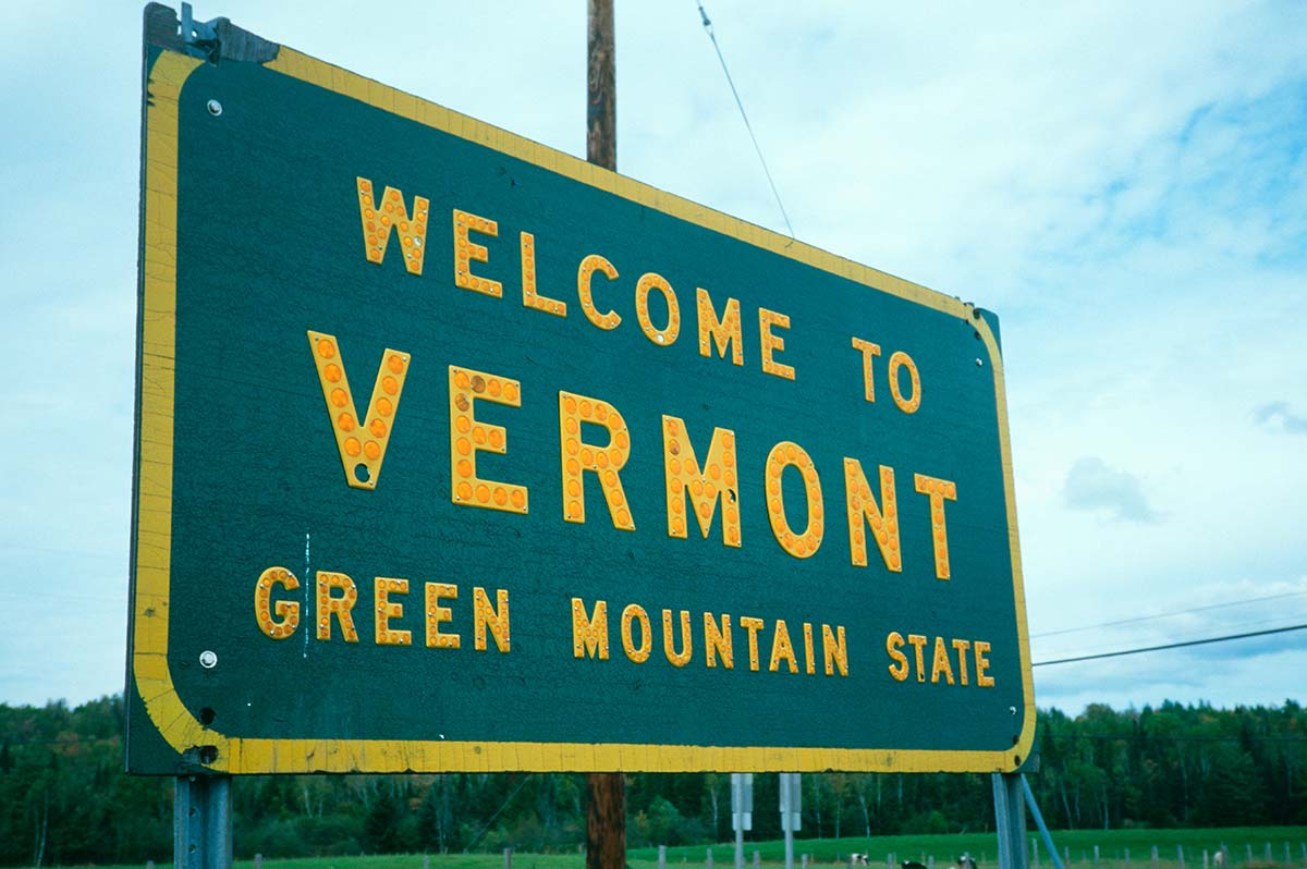 Roadside sign reading "Welcome to Vermont."