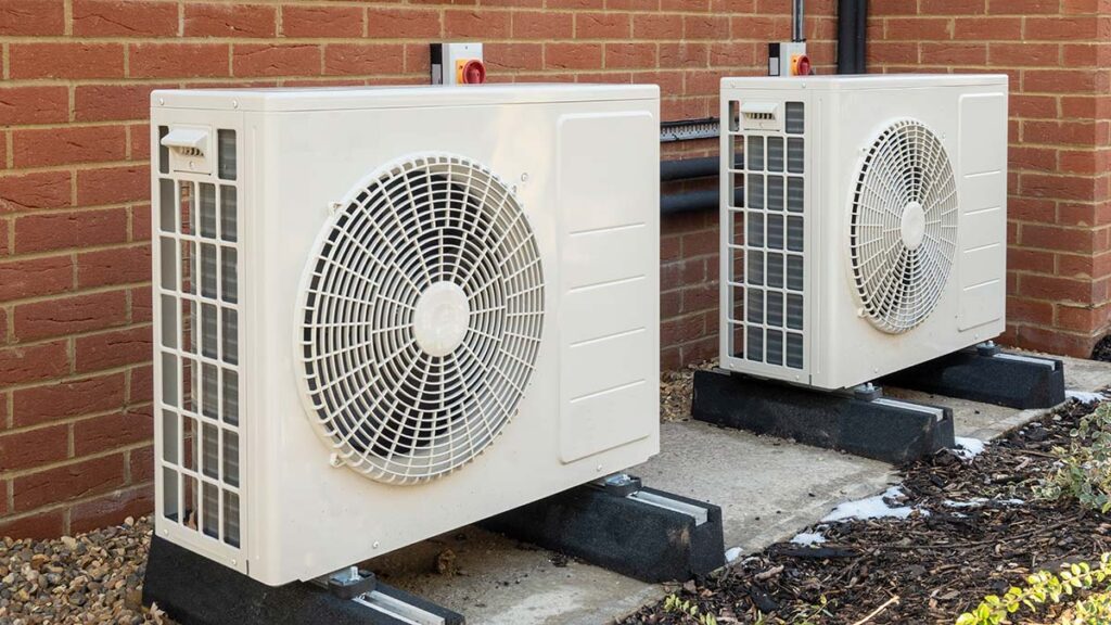 Outdoor heat pump units on a home, part of a heat pumps and solar system in Western Massachusetts