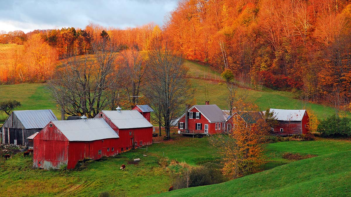 Older farmhouse and barns in Southern Vermont landscape, typical setting for solar panels on older farmhouses