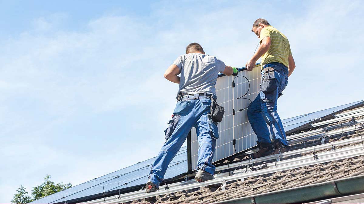 Solar installers on a roof highlighting what to expect during a Residential Solar Installation in the Pioneer Valley