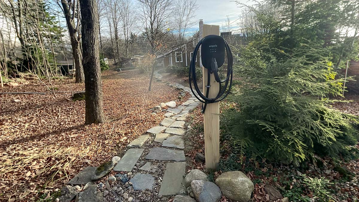 An example of a residential EV charger installed outdoors in the Keene, NH area as part of solar and EV charging at home