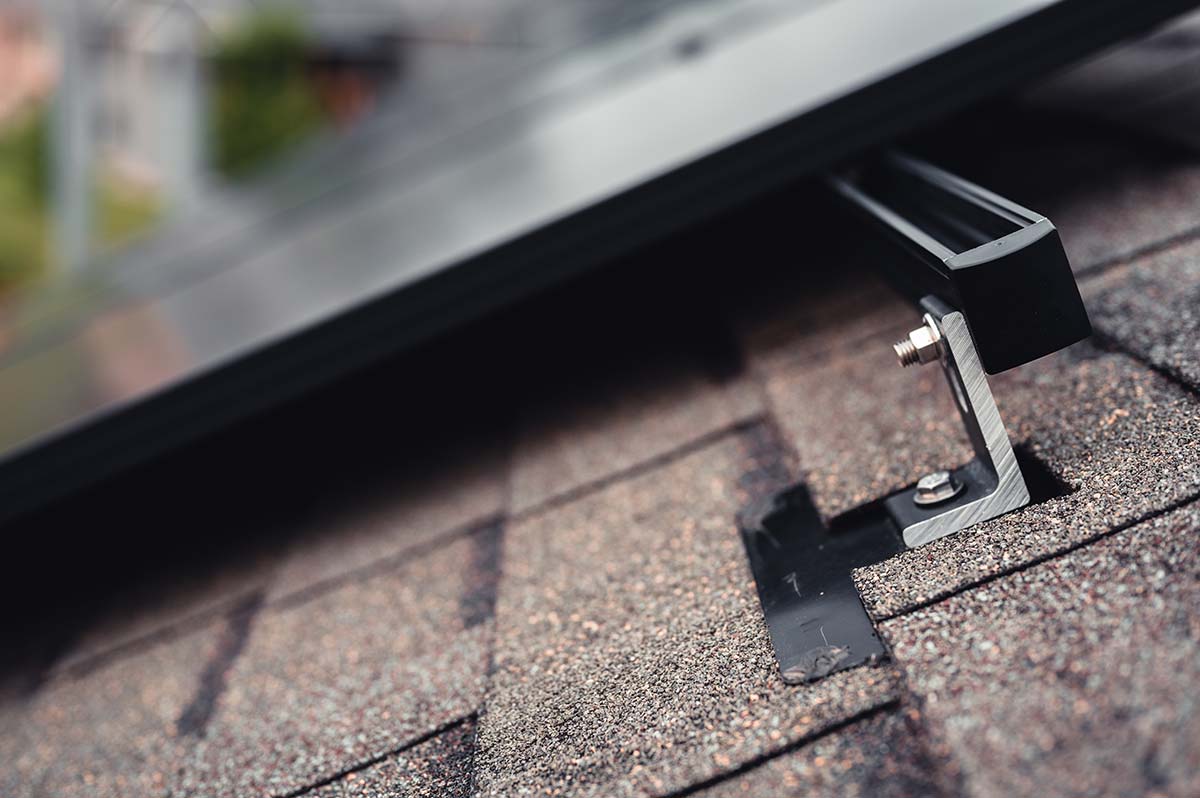 Residential solar panel installation in Greenfield MA showing roof-mounted hardware and panel attachment detail